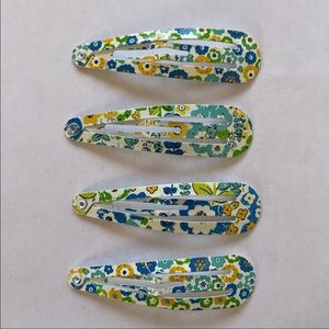 Two sets of VERA BRADLEY clips. Like new.